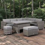 Outdoor patio furniture set with gray cushions on a wooden deck surrounded by trees.